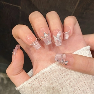 Sparkly butterfly cat eye press-on nails with 3D crystal accents and pearl chain decor