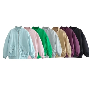 Detail view of multi-colored casual bomber jackets featuring ribbed cuffs and metal zippers
