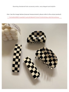 Detail view of black and white checkered acetate hair claws and rectangle clips set