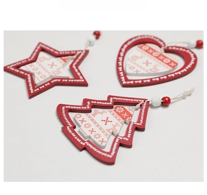 Macro detail of red and white wooden Christmas ornaments with snowflake patterns