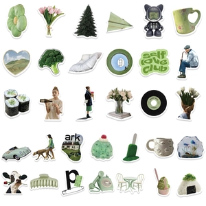 Close-up of Morandi green stickers featuring flowers and food for journal decoration