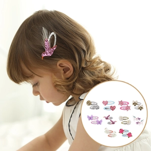 Detail showing assorted sequin hair clips including bird, heart, and star shapes for kids