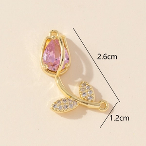 Detailed view of golden tulip connector charm with pink stone and dimensions 2.6cm x 1.2cm