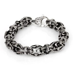 Detailed view of vintage cross link pattern and aged finish on men's steel bracelet