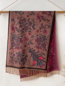 Detailed view of bohemian floral pashmina shawl with tassels in wine red and blue