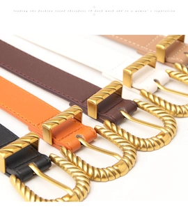 Detailed view of five colorful women's belts with elegant gold twisted metal buckles