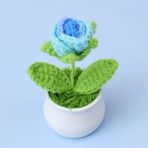 Handmade knitted blue rose flower in mini white ceramic pot for home and desk decor