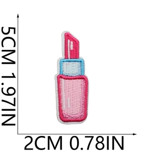 Detailed embroidery of a pink lipstick patch with light blue borders for DIY clothing