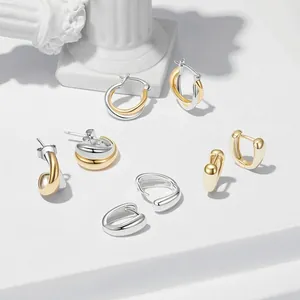 Polished 925 sterling silver drop earrings set on minimalist architectural display