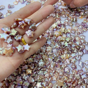 Close-up of iridescent star-shaped freshwater pearl beads with vibrant pearlescent luster