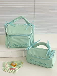 Mint green waterproof toiletry bag set with cute ribbon bow and delicate embroidery