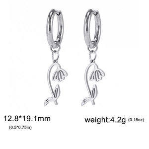 Silver stainless steel hoop earrings with hollow flower charms on white background