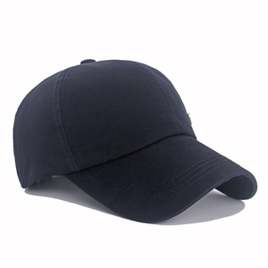 Detailed close-up of navy blue cotton baseball cap stitching and six-panel crown structure