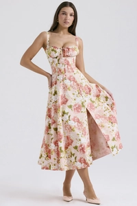 Detail of floral backless midi dress featuring a side slit and pink floral pattern