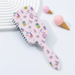 Pink unicorn hairbrush featuring massage bristles and a vibrant cartoon pattern design