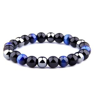 Detail of 8mm hematite and tiger eye stone beads on a flexible yoga bracelet