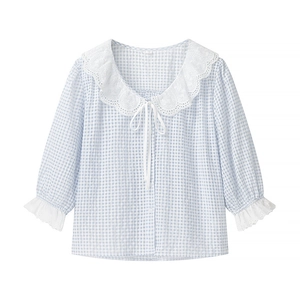 Detail showing white lace oversized collar and cuffs on blue plaid shirt blouse