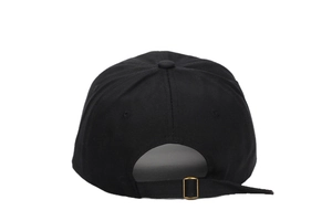 Detail view of black cotton baseball cap showing back metal buckle and adjustable strap