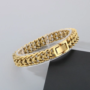Detailed view of heavy gold-plated keel chain bracelet with polished interlocking links
