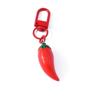 Creative red chili pepper keychain with red metal lobster clasp on white background