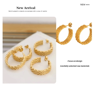 Detailed close-up of golden geometric woven textured earrings in a luxury lifestyle setting