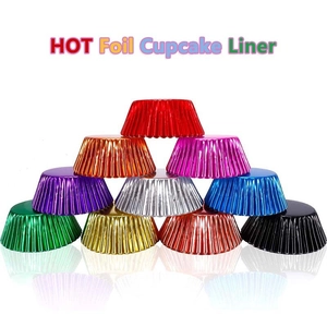 Multi-colored foil cupcake liners stacked in pyramid layout on white background
