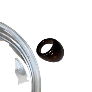 Retro geometric amber resin ring with dark brown marble texture on white background
