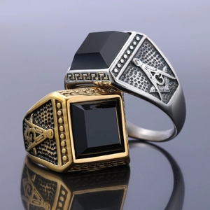 Vintage stainless steel Masonic ring with black gemstone and G symbol on mirror surface