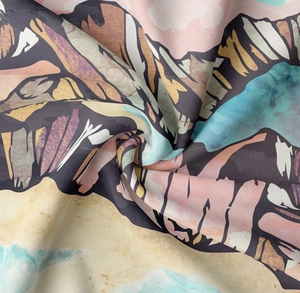 Macro detail of abstract mountain landscape print on soft textured tapestry fabric