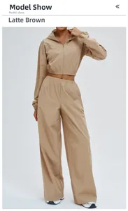 Detailed latte brown windbreaker sports set featuring zip hoodie and wide-leg trousers