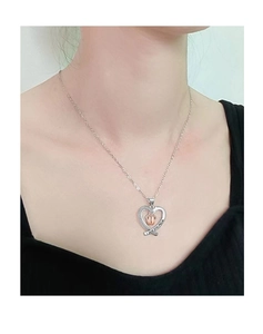 Detail of MOM heart pendant with baby feet inlay and I love you MOM engraving