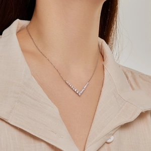 Close-up of S925 sterling silver V-shaped pendant necklace with cubic zirconia