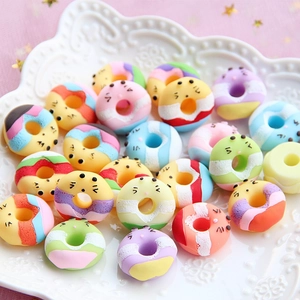 Colorful resin donut charms with cute expressions for DIY crafts in macaroon shades