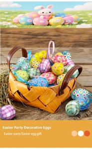 Detailed view of floral Easter eggs in a woven basket with decorative straw padding