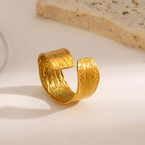 Golden wide open ring with hammered texture and geometric minimalist stainless steel design