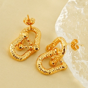 Vintage gold horseshoe earrings with hammer texture and lava finish for women