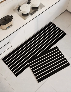 Set of two striped non-slip kitchen floor mats in a modern minimalist home setting