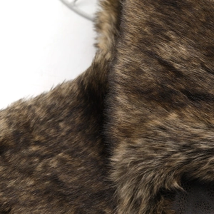 Close-up of thick faux fur lining detail on winter bomber hat for extra warmth