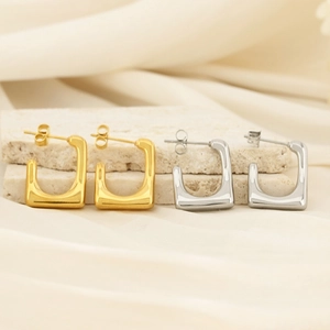 U-shaped geometric earrings in gold and silver finish on textured stones