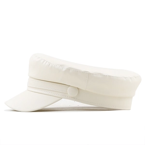 Detailed side view of a white leather baker boy hat with professional stitching and clean design
