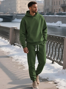 Detailed macro view of the forest green tracksuits with 3D diamond quilted knit texture