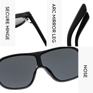 Detail view of large frame sunglasses with metal hinges and ergonomic curved temples