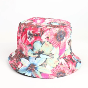 Detailed close-up of colorful floral sunflower pattern and stitching on a bucket hat