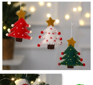 Detailed view of handmade wool felt Christmas tree ornaments with star tops and bokeh background