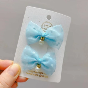 Light blue polka dot tulle bow hair clips with elegant pearl pendants for young girls