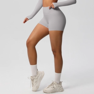 Side view of high-waisted grey yoga shorts showing seamless butt-lifting effect