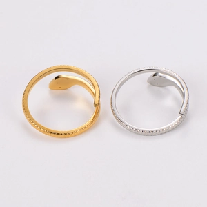 French vintage snake open ring with green eyes and detailed scale texture in gold and silver