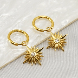 French vintage gold stainless steel earrings featuring star pendants with clear zircon