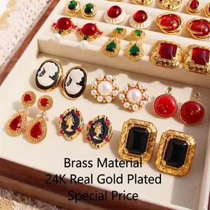 Vintage 24k gold-plated brass earrings with emerald green gems and baroque pearls