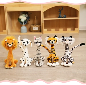 Row of plush animals including lion, dog, cat, and tigers on a wooden floor